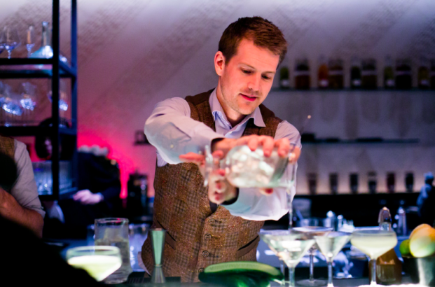 Hendrick's Gin Brand Ambassador Erik Andersson pouring his concoction of Hibiscus Gin Collins